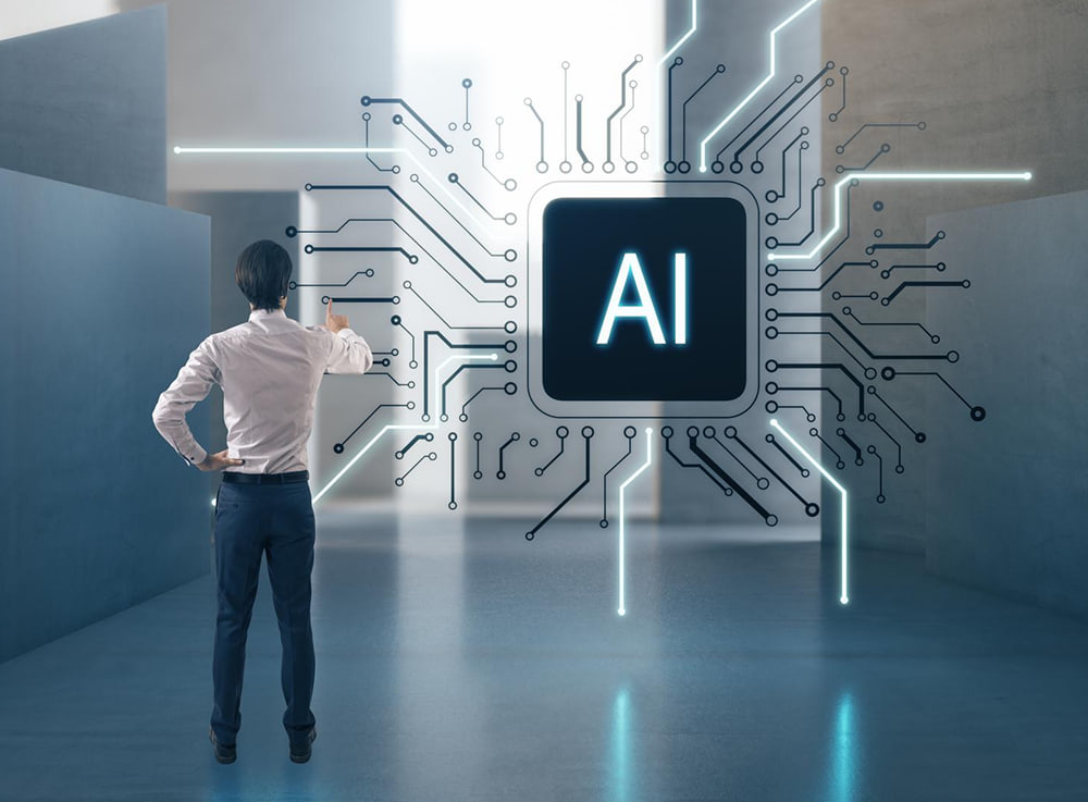A person facing a wall-sized AI chip with circuitry radiating from it.